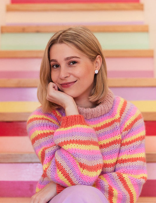 Jaime Dorfman wearing one of her colourful knitted jumpers