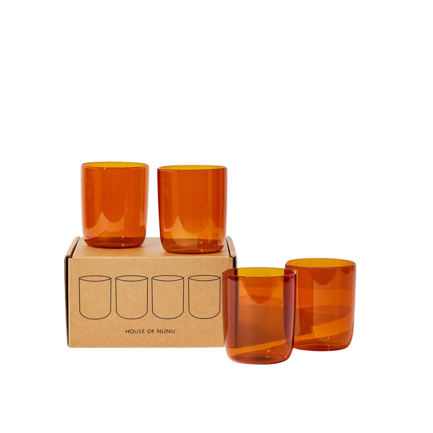 House of Nunu Amber Glass Set: Four amber coloured drinking glasses stacked on top of their brown box in front of a white backdrop. 