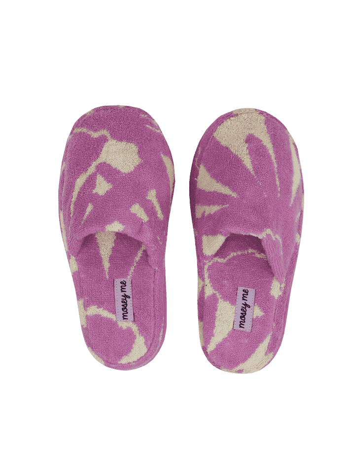 Mosey Me Slippers: A super cute design featuring a cream background with a plum purple flower across the print. They are made with cotton and have a fun texture to them making the design feel 3D. 