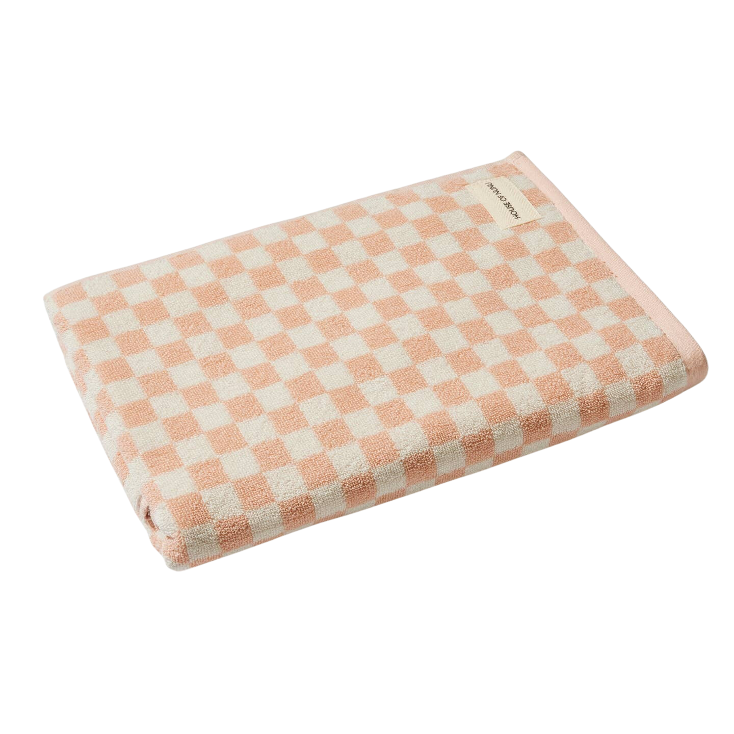 Bath towel in Pink Check by House of Nunu. This towel is white with soft peach checks and folded into a perfect rectangle. 