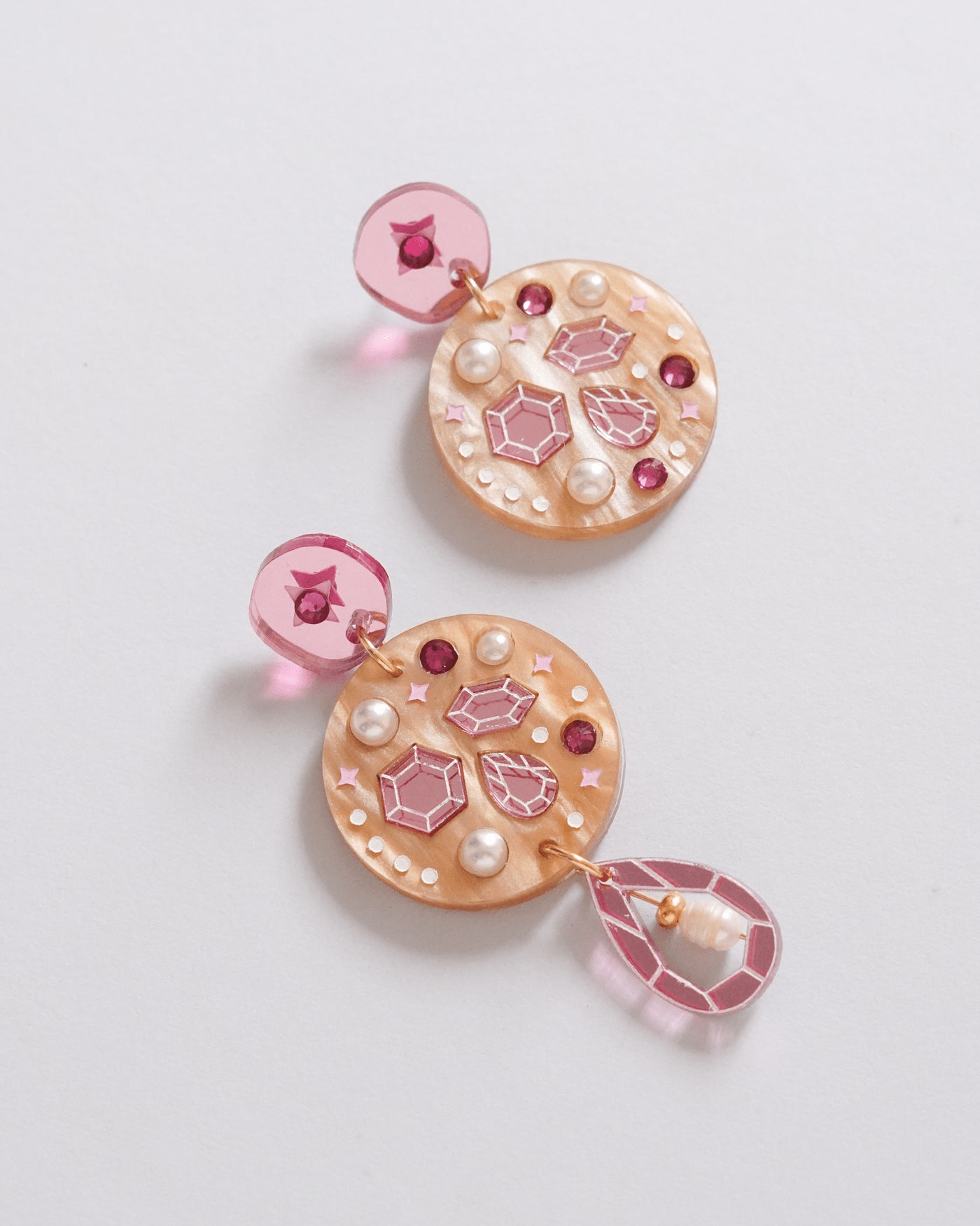 Flowature Celestial Earrings. Featuring pink gem stones, red gem stones and pearls. 