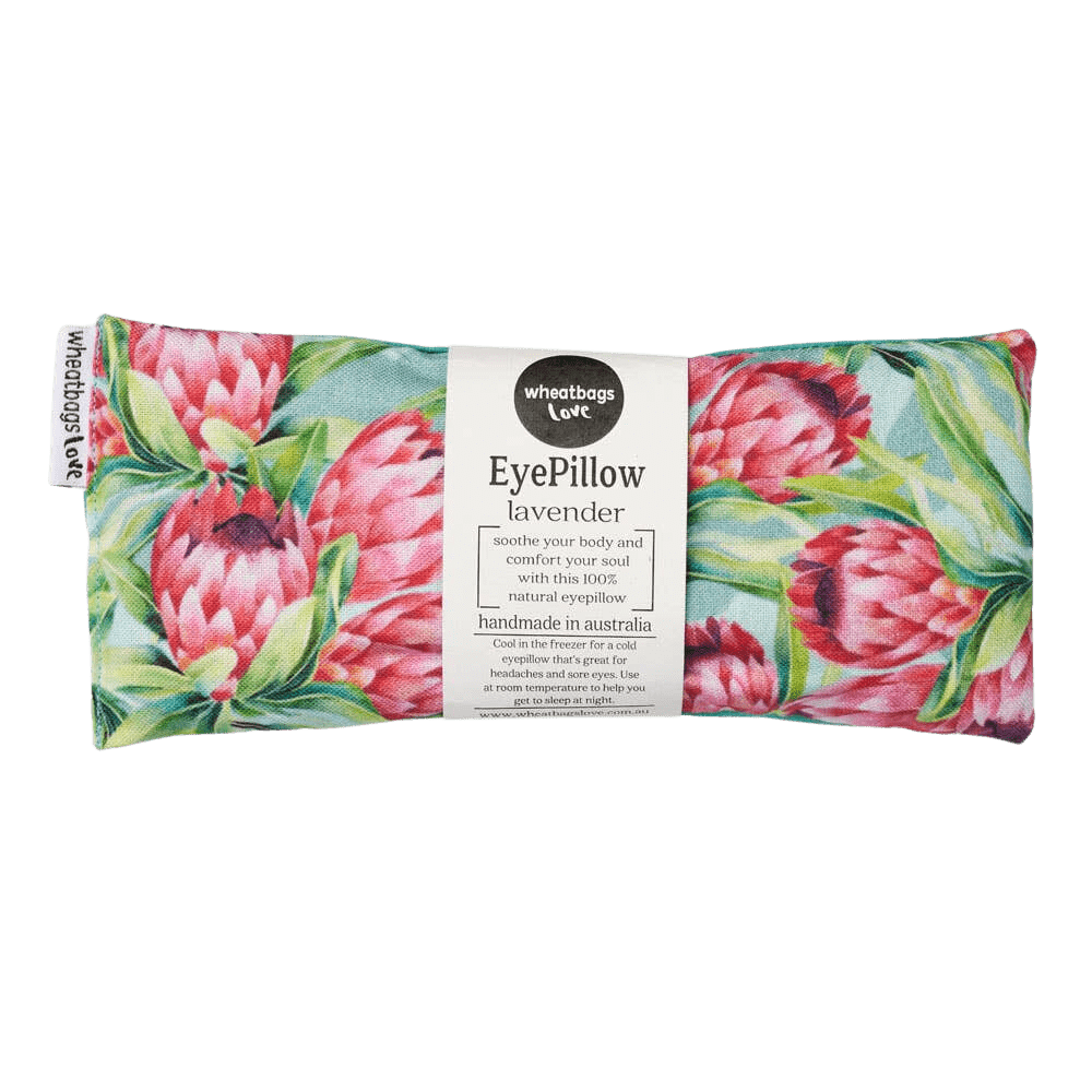 An eye pillow by Wheatbag Love featuring red proteas with green and aqua leaves. 