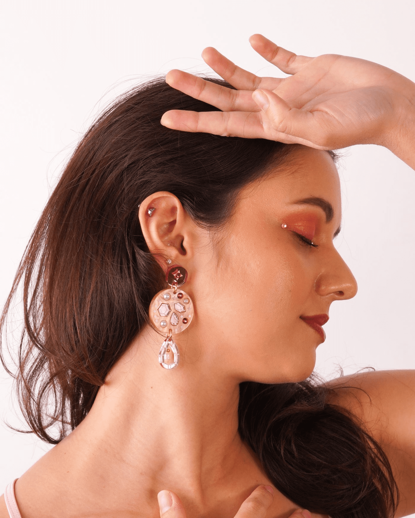 A flowature model wearing Celestial Droplet Earrings. 