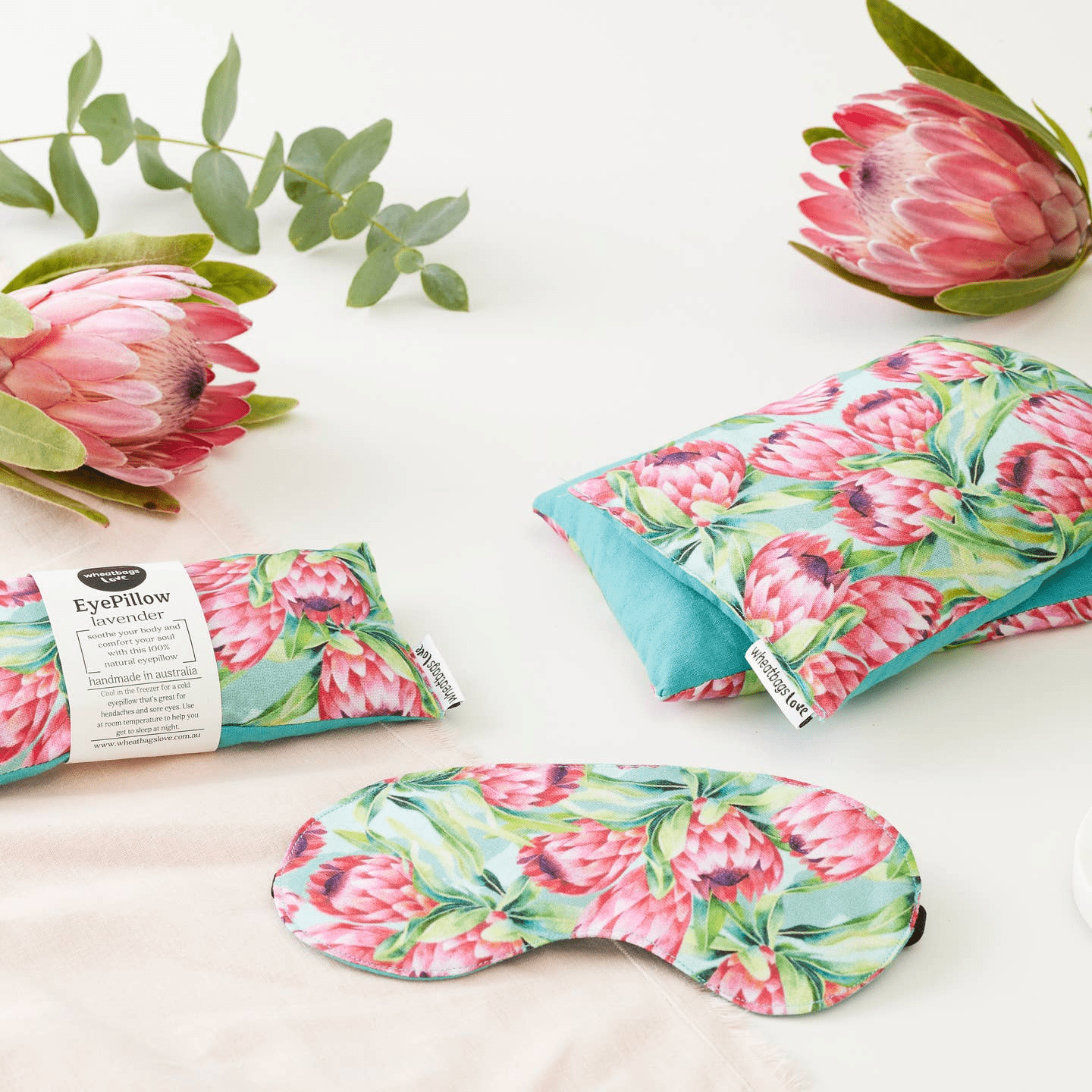 A cute collection of the same print, this time with a matching eye mask, wheatbag and eye pillow surrounded by protea flowers. 