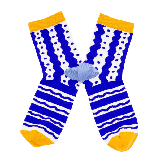 Shuh Lee Socks: Blue and white with a squiggle line design across the pattern with yellow splashes of colour at the toes and tops of each sock. 