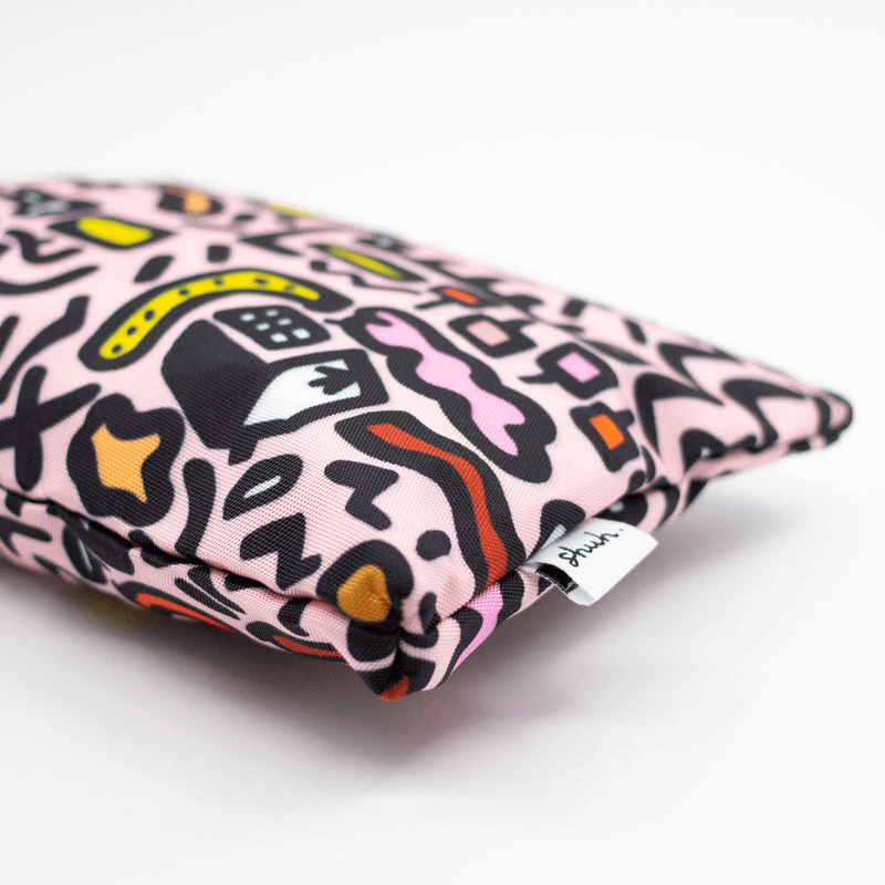 Shuh Lee Sweet Useful Bag: A pencil case with a pink background and black, orange, white, pink, yellow and red abstract shapes. 