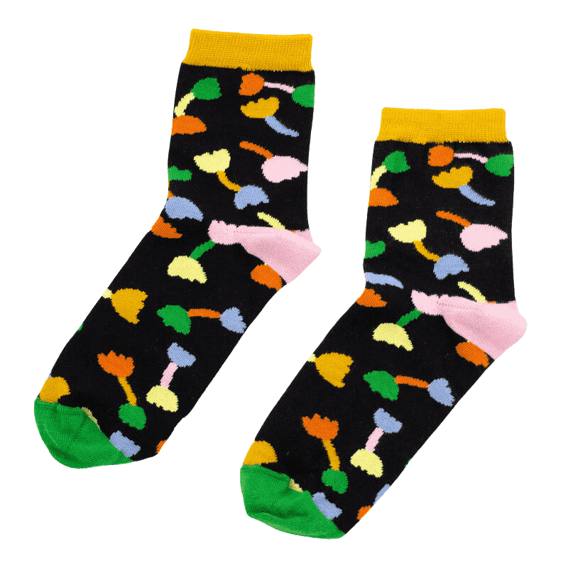 Shuh Lee Tulip Socks: A super cute design with a black backdrop and multicoloured tulips scattered across with green, pink and yellow splashes of colour at the top, heel and toe. 